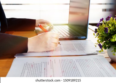 hand working on editing blur text on desk with laptop in office - Shutterstock ID 1509189215