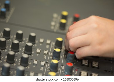 Hand Working On A Sound Mixing Desk In Studio