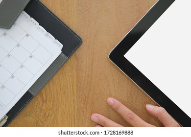 hand working with tablet. notebook on wooden desk table. office workplace workspace top view