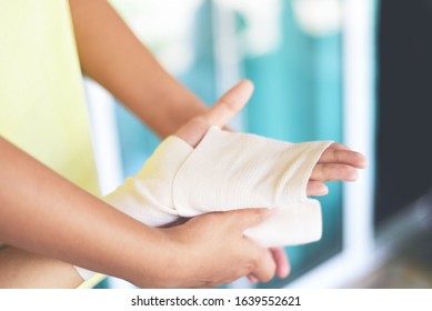 Hand Wound Bandaging Arm By Nurse / First Aid Wrist Injury Health Care And Medicine Concept