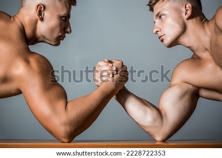 Hand wrestling, compete. Hands or arms of man. Rivalry, closeup of male arm wrestling. Two hands. Muscular men measuring forces, arms.