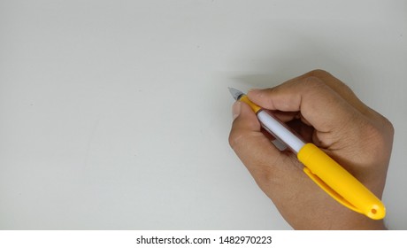 a hand write with a pen, close up