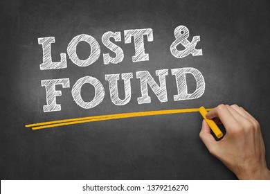 hand writes chalk text on blackboard - LOST and FOUND - Shutterstock ID 1379216270