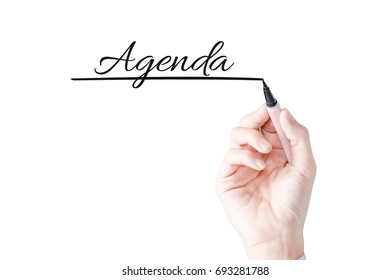 Hand Writing Agenda With Blue Marker On Transparent Board.