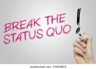 Hand Writing Break The Status Quo On Grey Background