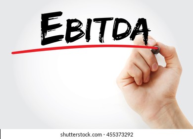 Hand writing EBITDA - Earnings Before Interest, Taxes, Depreciation and Amortization with marker, concept background