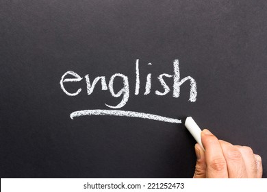 Hand writing English topic on chalkboard - Shutterstock ID 221252473