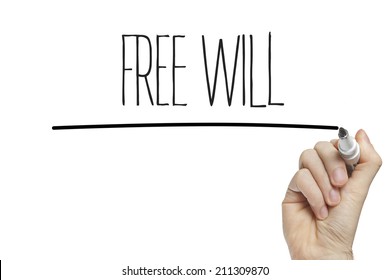 Hand Writing Free Will On A White Board