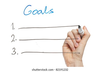 Hand Writing Goals On Whiteboard