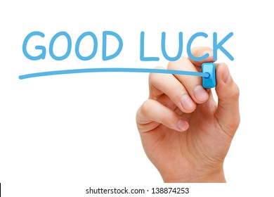 Hand writing Good Luck with blue marker on transparent wipe board.
