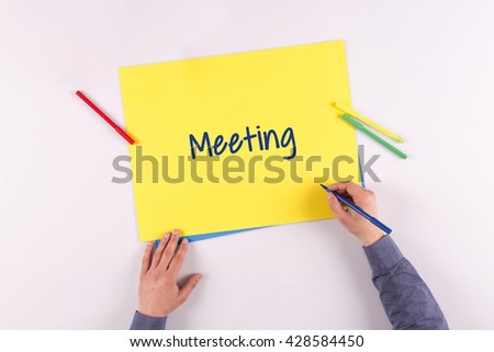 Hand writing Meeting on yellow paper