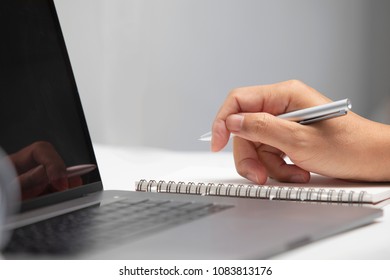 Hand writing in notebook - Shutterstock ID 1083813176
