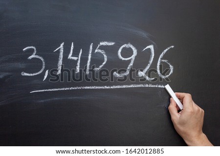Hand writing the number Pi on a chalkboard