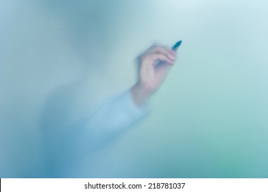 Hand Writing On Blurred Glass Wall, Abstract Background With Space Editable