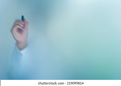 Hand Writing On Blurred Glass Wall, Abstract Background With Space Editable