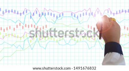 Hand writing on white board in strategy 
 design ,white chalk towriting with pencil on business board  with stock market concept graph for time line cover or website background, with copy space.