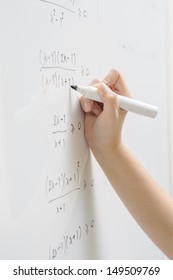 A Hand Writing On Whiteboard