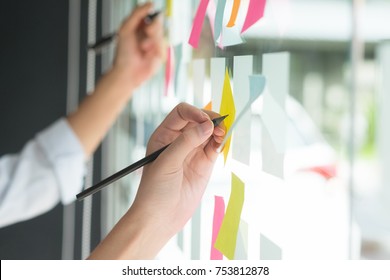 Hand Writing Paper Note, Sticky Note On Glass Window With Close Up Shot.