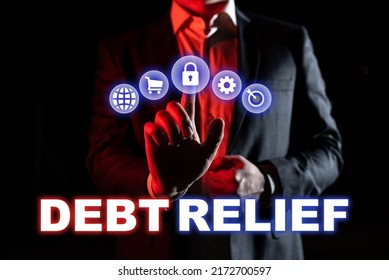 Hand Writing Sign Debt Relief. Concept Meaning Partial Or Total Remission Of It Especially Those By Countries 