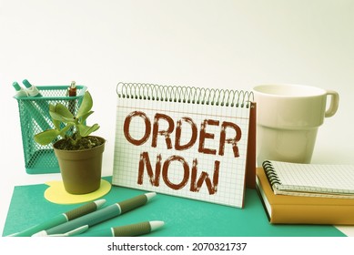 Hand Writing Sign Order Now. Business Concept Confirmed Request By One Party To Another To Buy Sell Tidy Workspace Setup Writing Desk Tools And Equipment Taking Notes