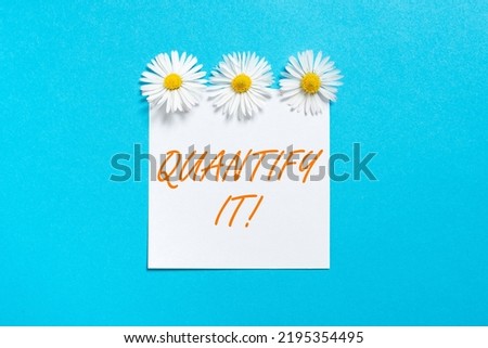 Hand writing sign Quantify It. Internet Concept Measure the size or amount of something and express in numbers Sticky Note With Important Messages With Three Flowers Above.