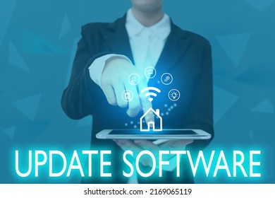 Hand writing sign Update Software. Conceptual photo replacing program with a newer version of same product Lady Pressing Screen Of Mobile Phone Showing The Futuristic Technology - Shutterstock ID 2169065119