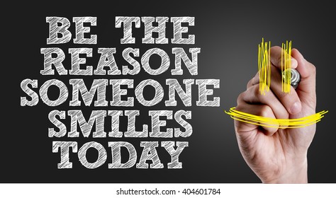 Hand writing the text: Be The Reason Someone Smiles Today - Shutterstock ID 404601784