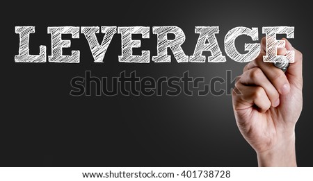 Hand writing the text: Leverage