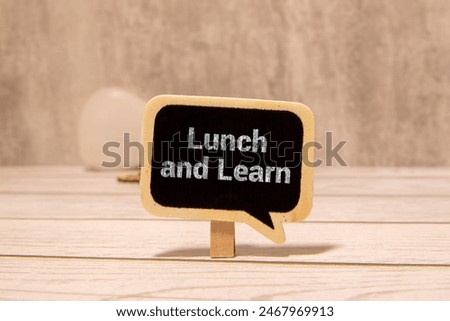 Hand writing the text: Lunch and Learn.