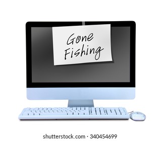 A Hand Written Gone Fishing Sign Note Is Taped To A Computer Monitor Showing That The Business Man Or Business Woman Worker Is Out On Vacation Or Gone For The Day And Not Working.