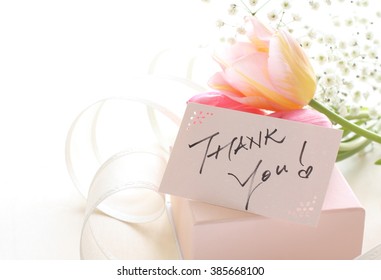 hand written Thank you card on gift box with Tulip