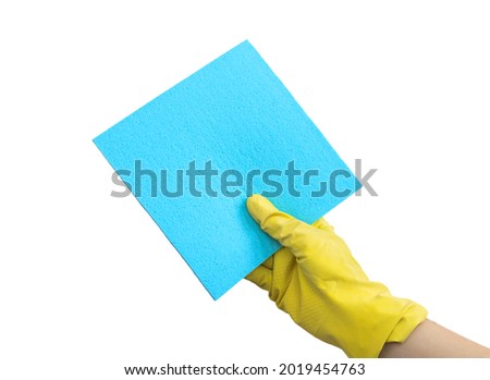 Hand in yellow glove using rag isolated on a white background photo