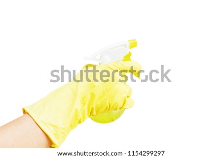 Woman’s hand in yellow rubber glove with spray on white background. Isolated on white