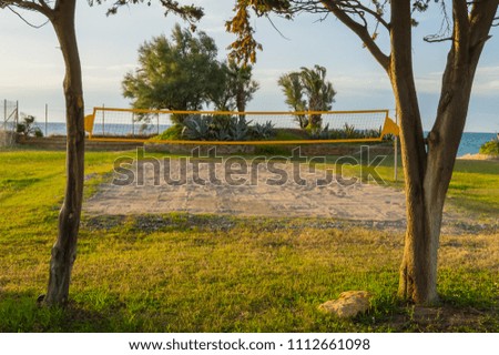 Handball field between two trees at sunset facing the sea in northern Sicily