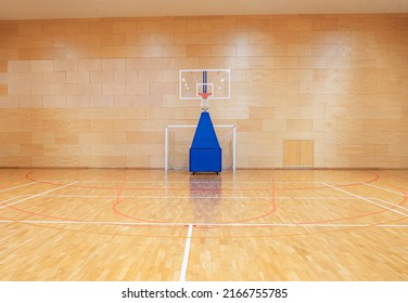 Handball goal and movable basketball basket in the gym - Powered by Shutterstock