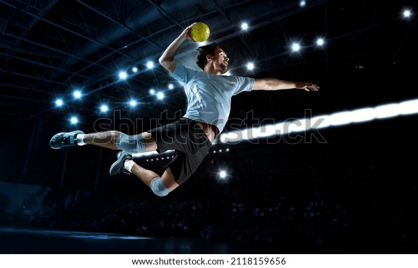 Handball player players in action. Sports banner.\
Attack concept with copy\
space