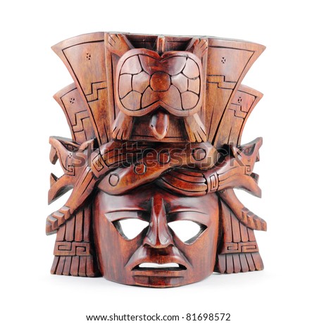 Hand-carved wooden Mayan mask isolated on a white background.