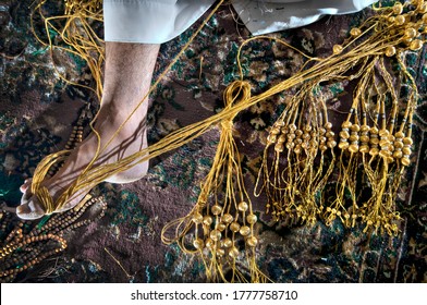 Handcraft Of An Arab Man Using Golden Threads To Make Arab Bisht