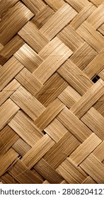Handcrafted diagonal basketry weave pattern background. Close-up of intricately interwoven natural dried bamboo splits, showcasing organic golden-brown textures, fibrous details, and traditional Asian craftsmanship