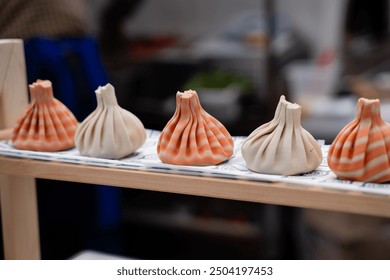 Handcrafted dumplings beautifully showcase a vibrant array of colors and intricate designs, making them ideal for stunning food photography and perfect examples of culinary art - Powered by Shutterstock