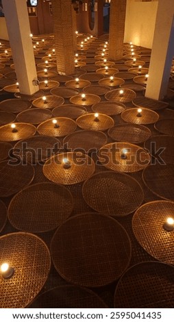 Handcrafted Harmony: This image showcases the beauty of traditional woven trays repurposed as unique candle holders. Perfect for highlighting cultural crafts and sustainable design.