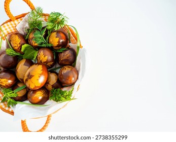 Handcrafted red Easter eggs with botanical patterns on white background