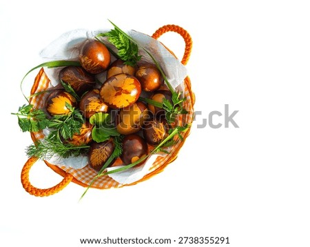 Handcrafted red Easter eggs with botanical patterns on white background