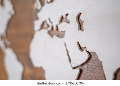 Handcrafted wooden world map with focus on the Arab Peninsula and the Persian Gulf