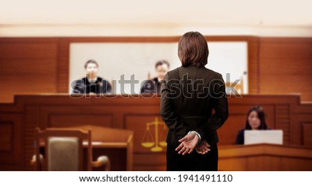 handcuffed on guilty hand in the trial court in front of the judge for law and adjustment concept