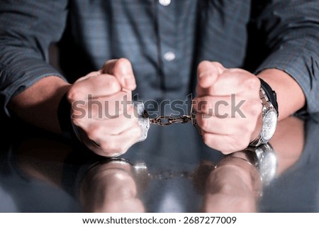 Handcuffs concept on a table