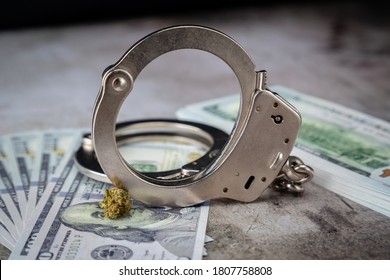 Handcuffs On $100 Bills On Concrete Floor For Crime Or DUI