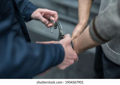 Handcuffs On The Prisoner. Making An Arrest. Remand In Custody