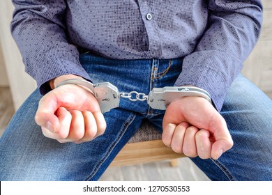 Handcuffs On The Wrists Of The Detained Man