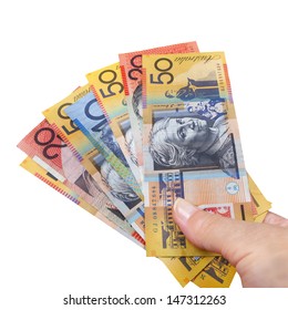Handful of Australian money, isolated over white,